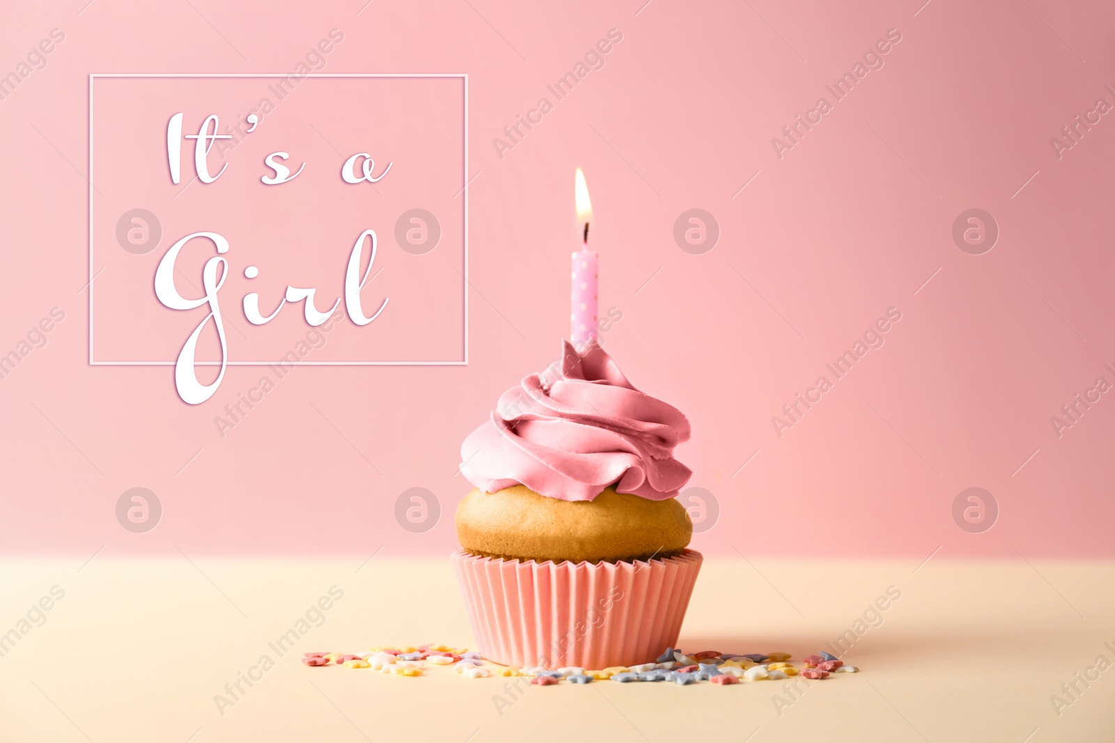 Image of Baby shower cupcake with candle for girl on pink background