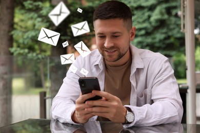 Image of Smiling man with smartphone chatting outdoors. Many illustrations of envelope as incoming messages out of device