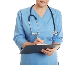 Closeup of female doctor in scrubs with clipboard isolated on white. Medical staff