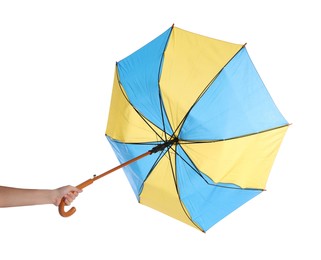 Photo of Woman with umbrella caught in gust of wind on white background, closeup
