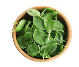 Wooden bowl of fresh green healthy baby spinach on white background, top view