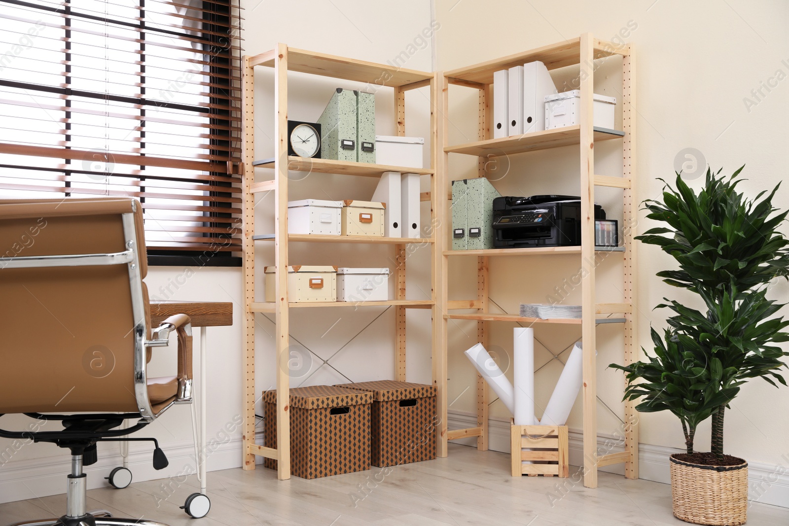 Photo of Modern home workplace with wooden storage. Idea for interior design