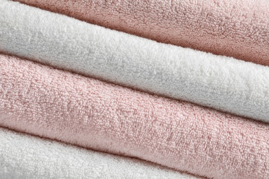 Photo of Stack of fresh soft towels as background