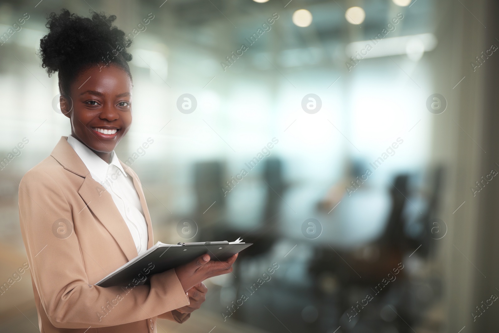 Image of Lawyer, consultant, business owner. Confident woman with clipboard smiling indoors, space for text