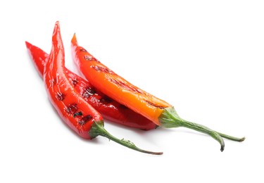 Tasty grilled chili peppers isolated on white