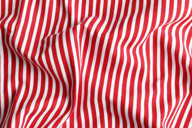 Photo of Texture of red striped fabric as background, closeup