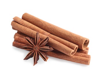 Photo of Aromatic cinnamon sticks and anise star isolated on white