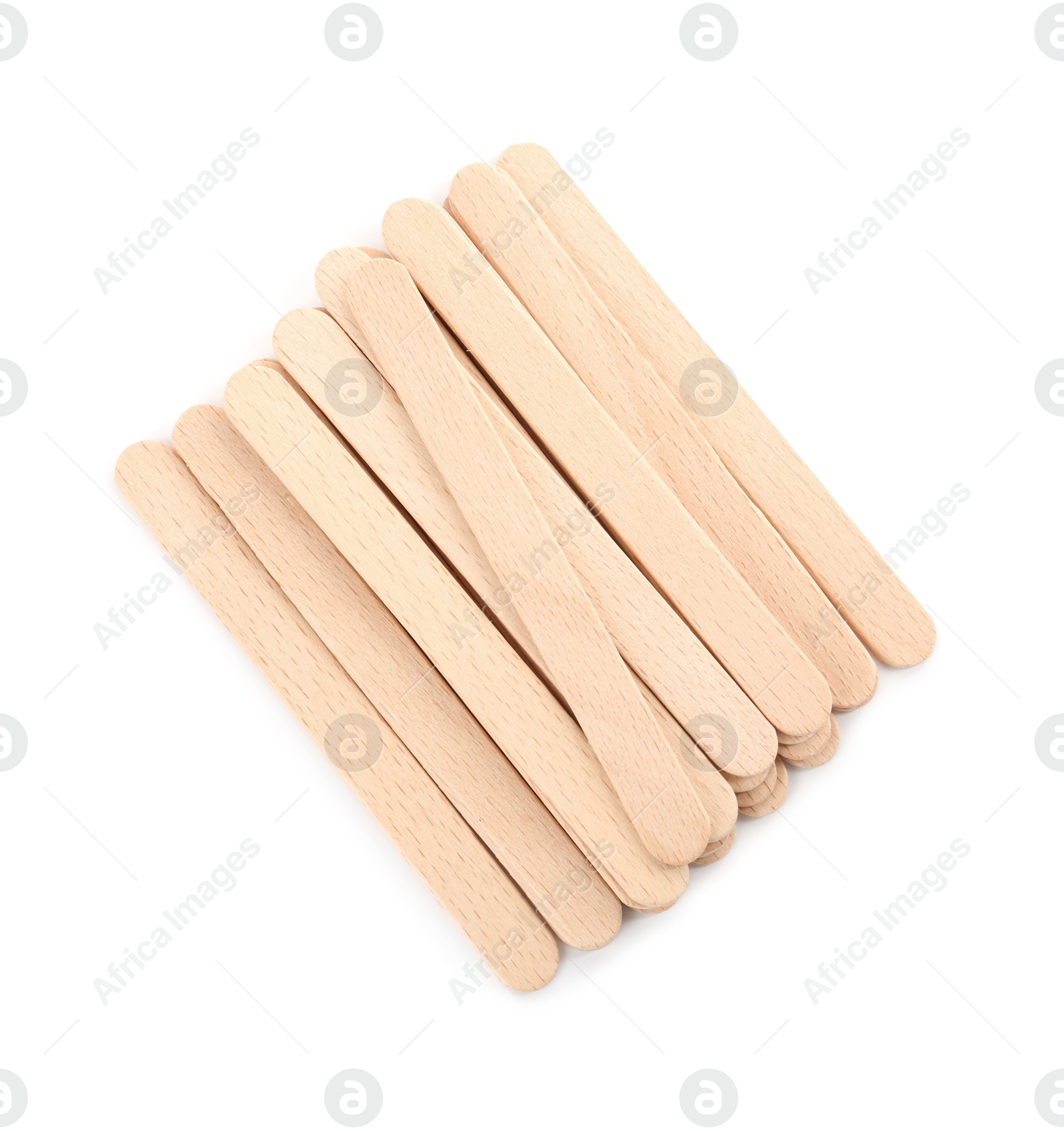 Photo of Disposable wooden spatulas for depilatory wax on white background, top view