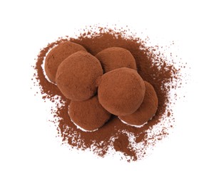 Delicious chocolate truffles powdered with cocoa on white background, top view