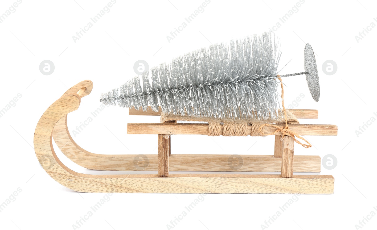 Photo of Wooden sleigh with decorative fir tree on white background. Christmas holidays