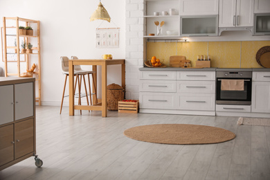 Modern kitchen interior with stylish wooden table