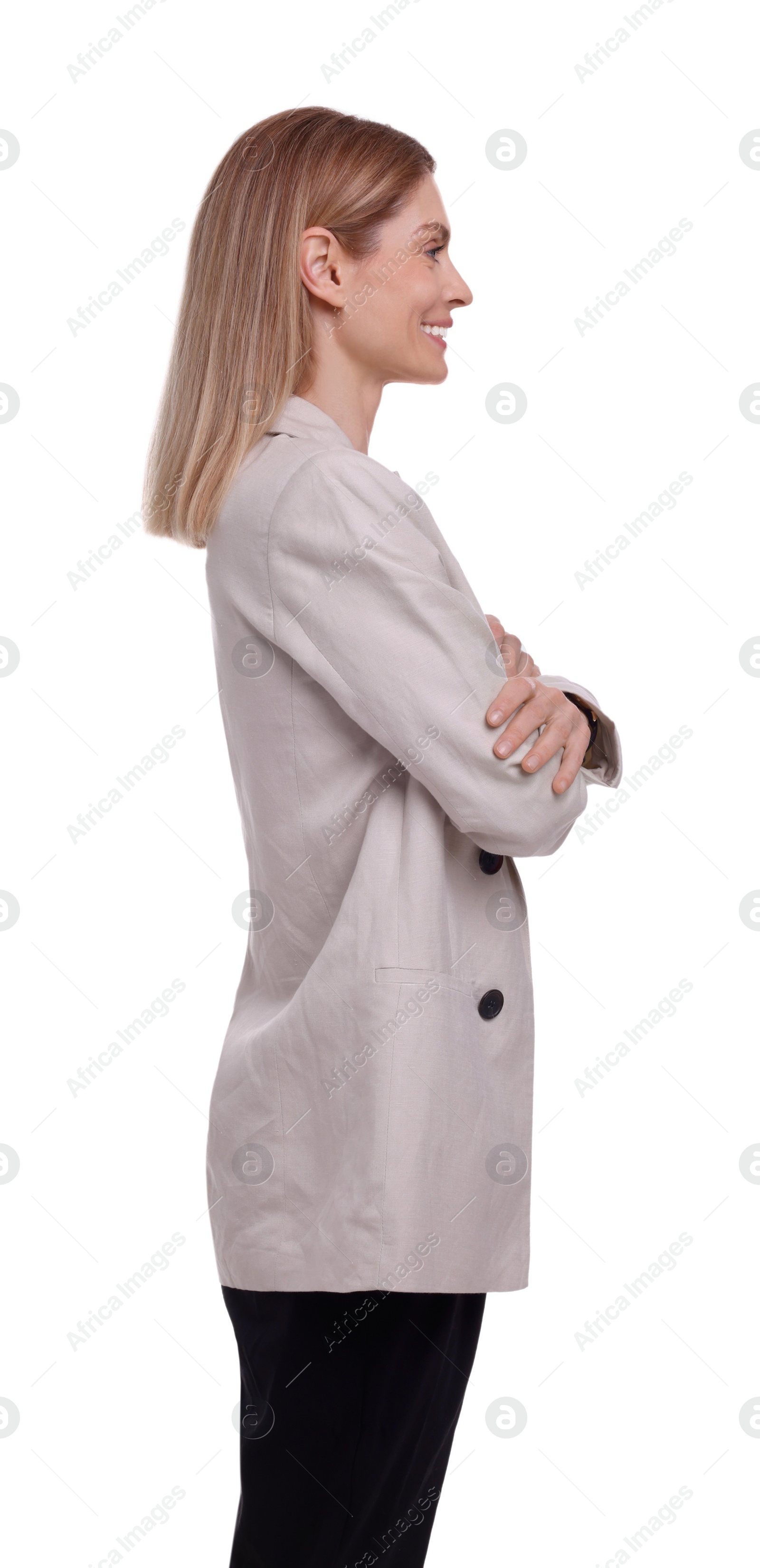 Photo of Beautiful happy businesswoman crossing arms on white background