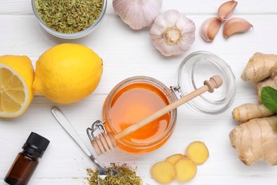 Photo of Different natural cold remedies on white wooden table, flat lay. Cough treatment