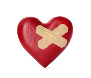 Photo of Red wooden heart with sticking plasters isolated on white