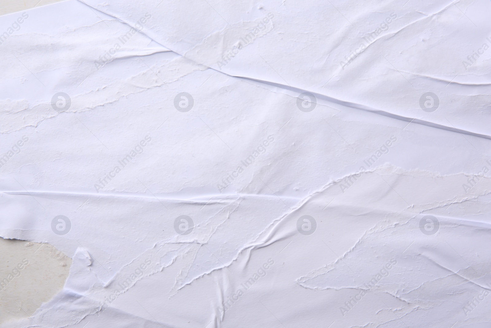 Photo of Texture of white ripped paper poster, closeup view