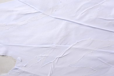 Photo of Texture of white ripped paper poster, closeup view
