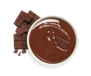 Photo of Milk chocolate paste in bowl and pieces isolated on white, top view