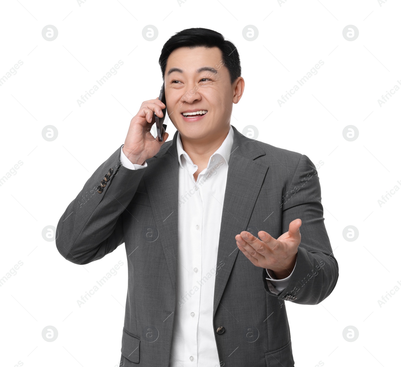 Photo of Businessman in suit talking on phone against white background