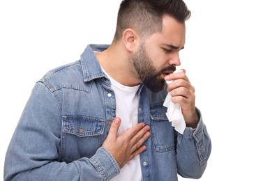 Photo of Sick man with tissue coughing on white background