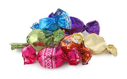 Sweet candies in colorful wrappers on white background