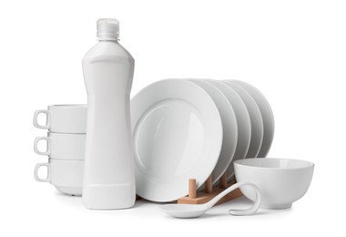 Photo of Clean dishware and bottle of detergent isolated on white