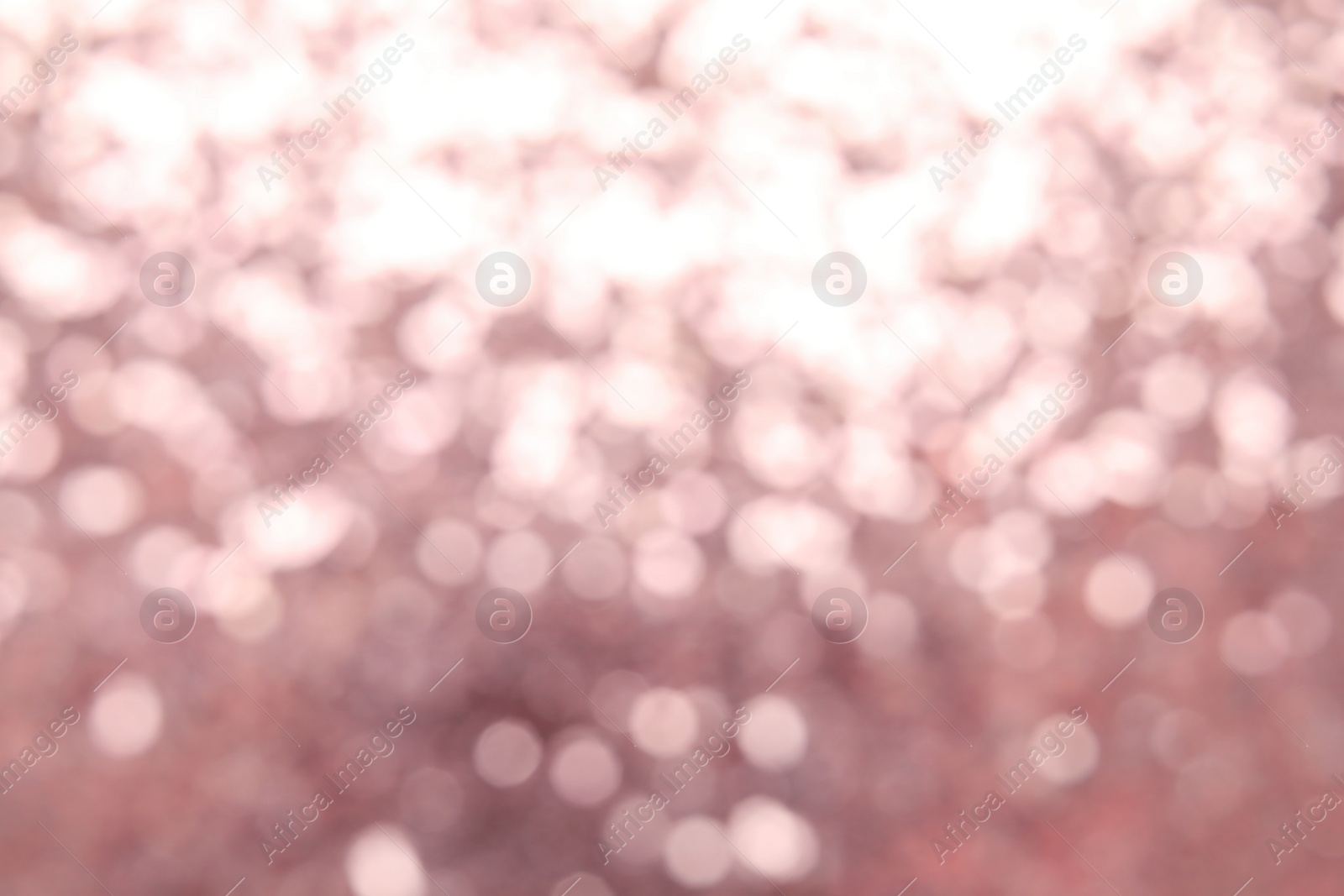 Photo of Blurred view of color glitter as background