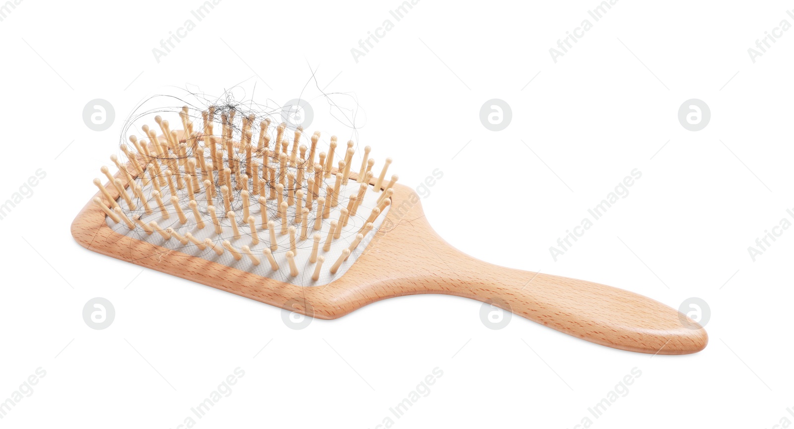 Photo of Wooden brush with lost hair on white background