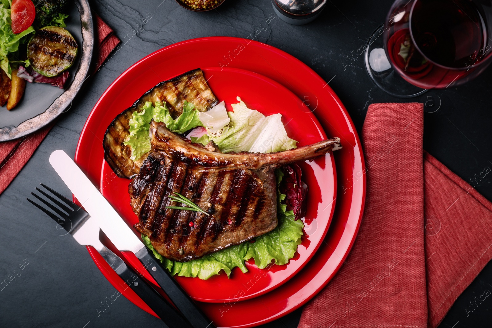 Image of Delicious beef steak served on grey table, flat lay. Food photography  