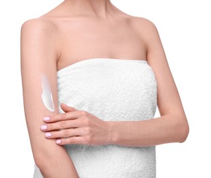 Woman with smear of body cream on her arm against white background, closeup