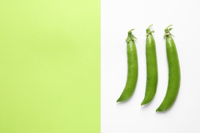 Photo of Flat lay composition with fresh peas on color background