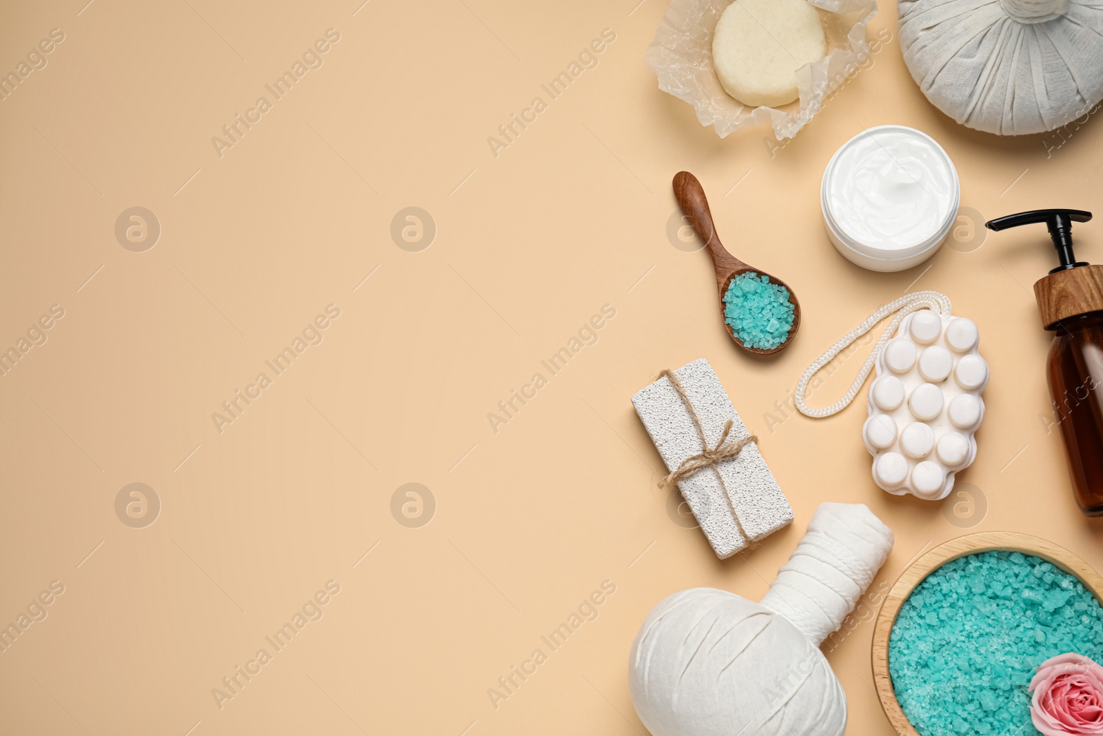 Photo of Flat lay composition of herbal bags and spa products on beige background, space for text