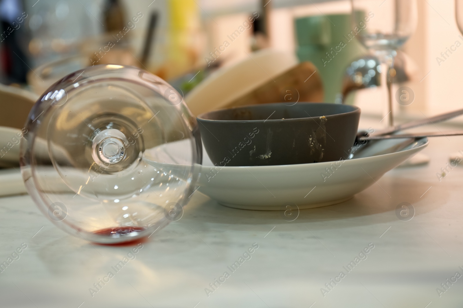 Photo of Dirty dishes on light countertop after new year party, closeup