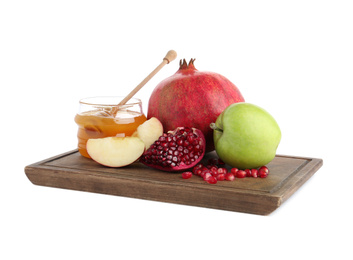 Photo of Honey, apples and pomegranate on white background. Rosh Hashanah holiday