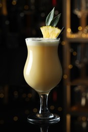 Photo of Tasty Pina Colada cocktail on bar countertop