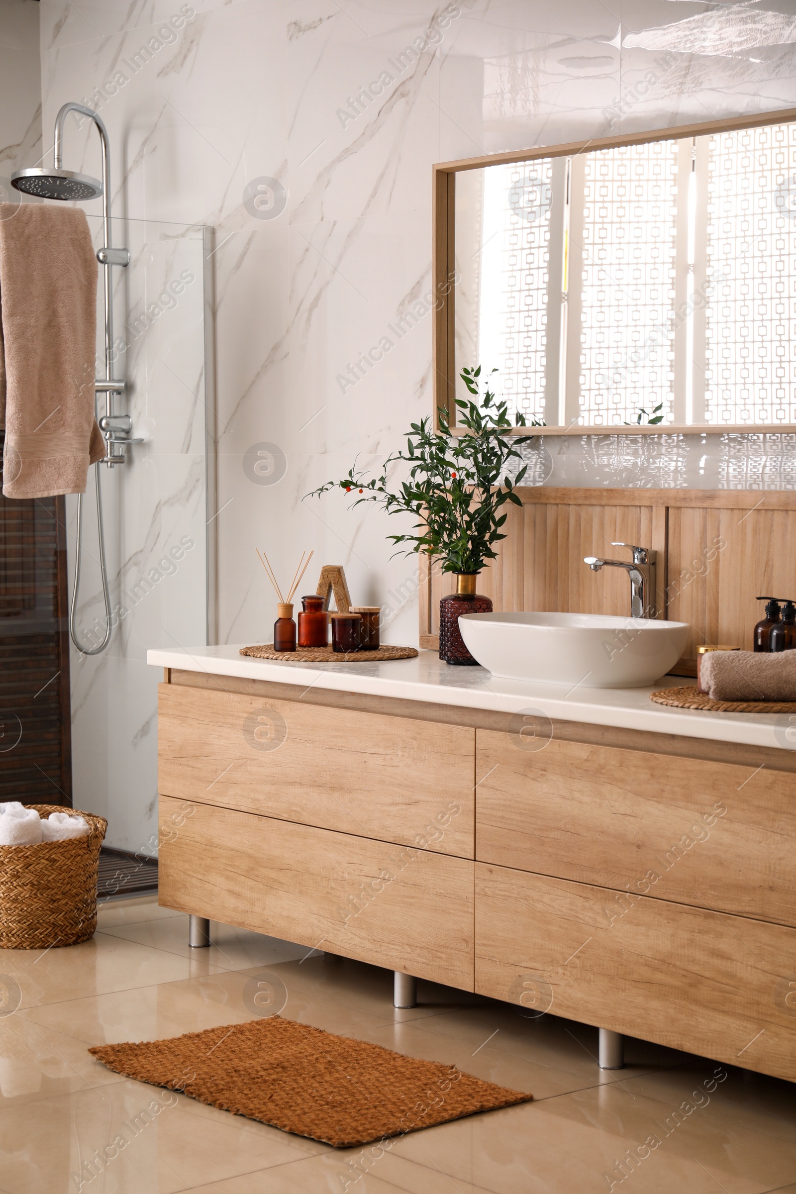 Photo of Modern bathroom interior with stylish mirror and vessel sink