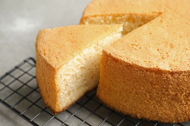 Photo of Delicious fresh homemade cake on grey table, closeup