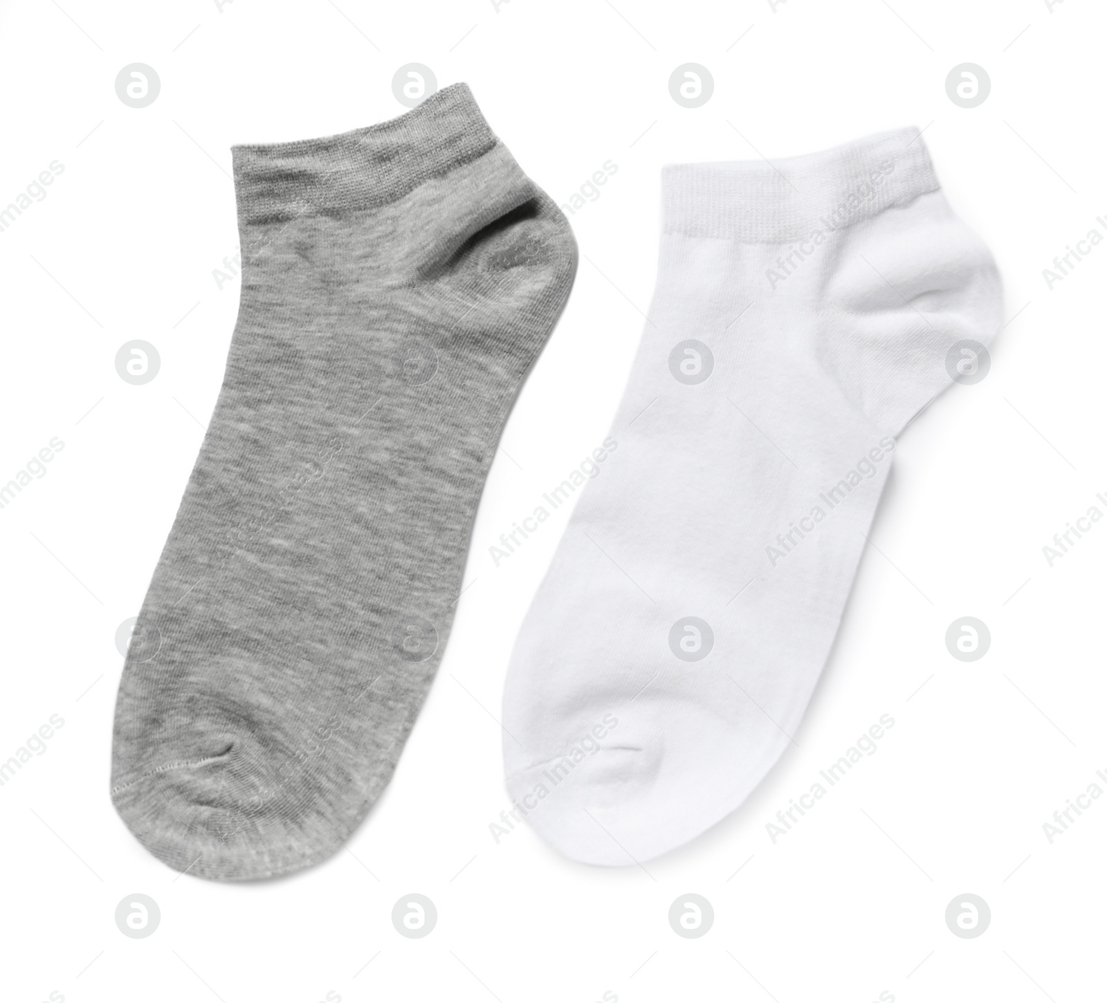 Photo of Different socks isolated on white, top view