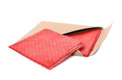 Photo of Red reusable beeswax food wraps on white background