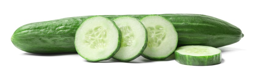 Whole cucumber and pieces of one isolated on white