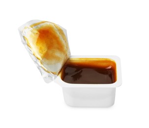 Tasty barbecue sauce in plastic container isolated on white