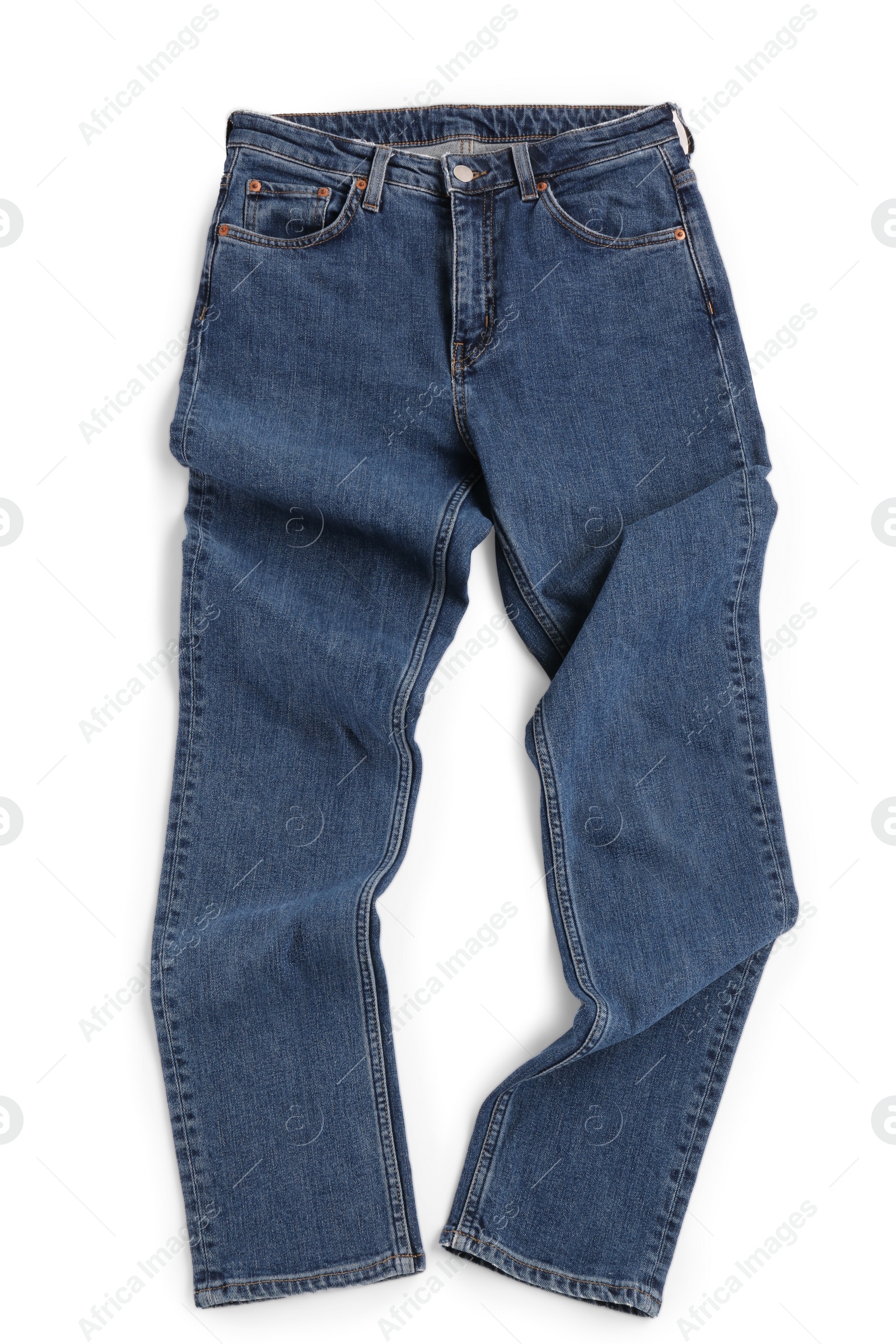 Photo of Rumpled dark blue jeans isolated on white, top view. Stylish clothes
