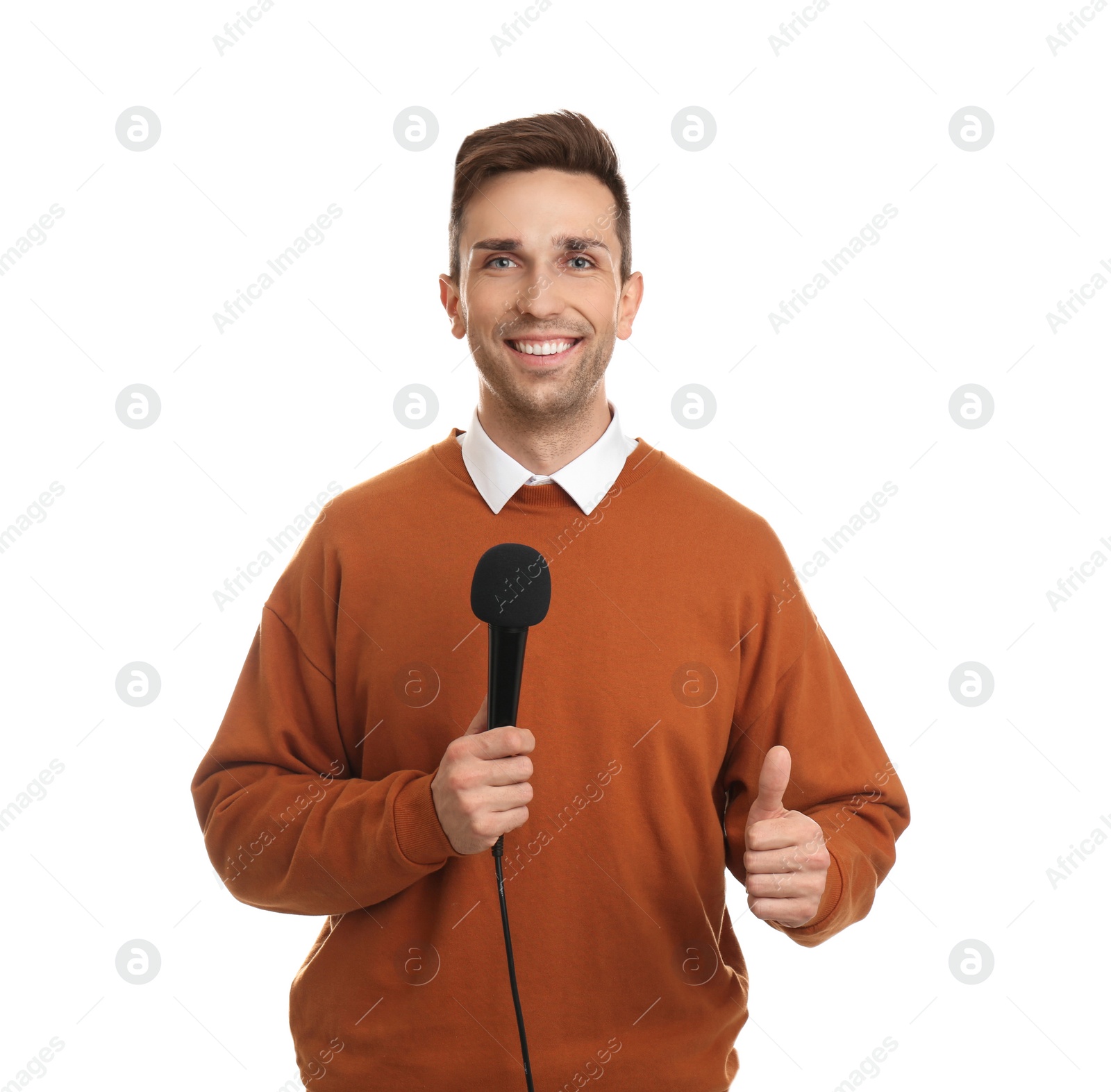 Photo of Young male journalist with microphone on white background