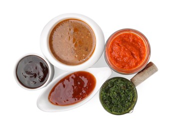 Photo of Different marinades isolated on white, top view