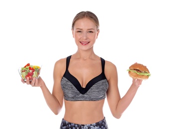 Slim woman with burger and salad on white background. Healthy diet