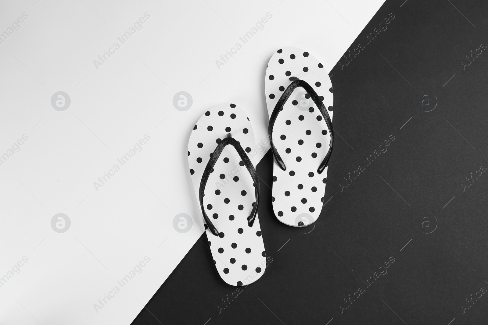 Photo of Stylish flip flops on color background, flat lay