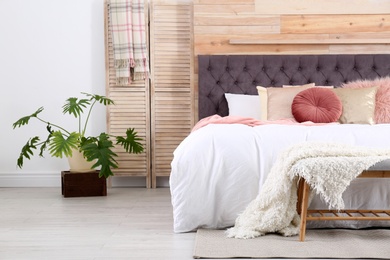 Modern interior design of cozy light bedroom