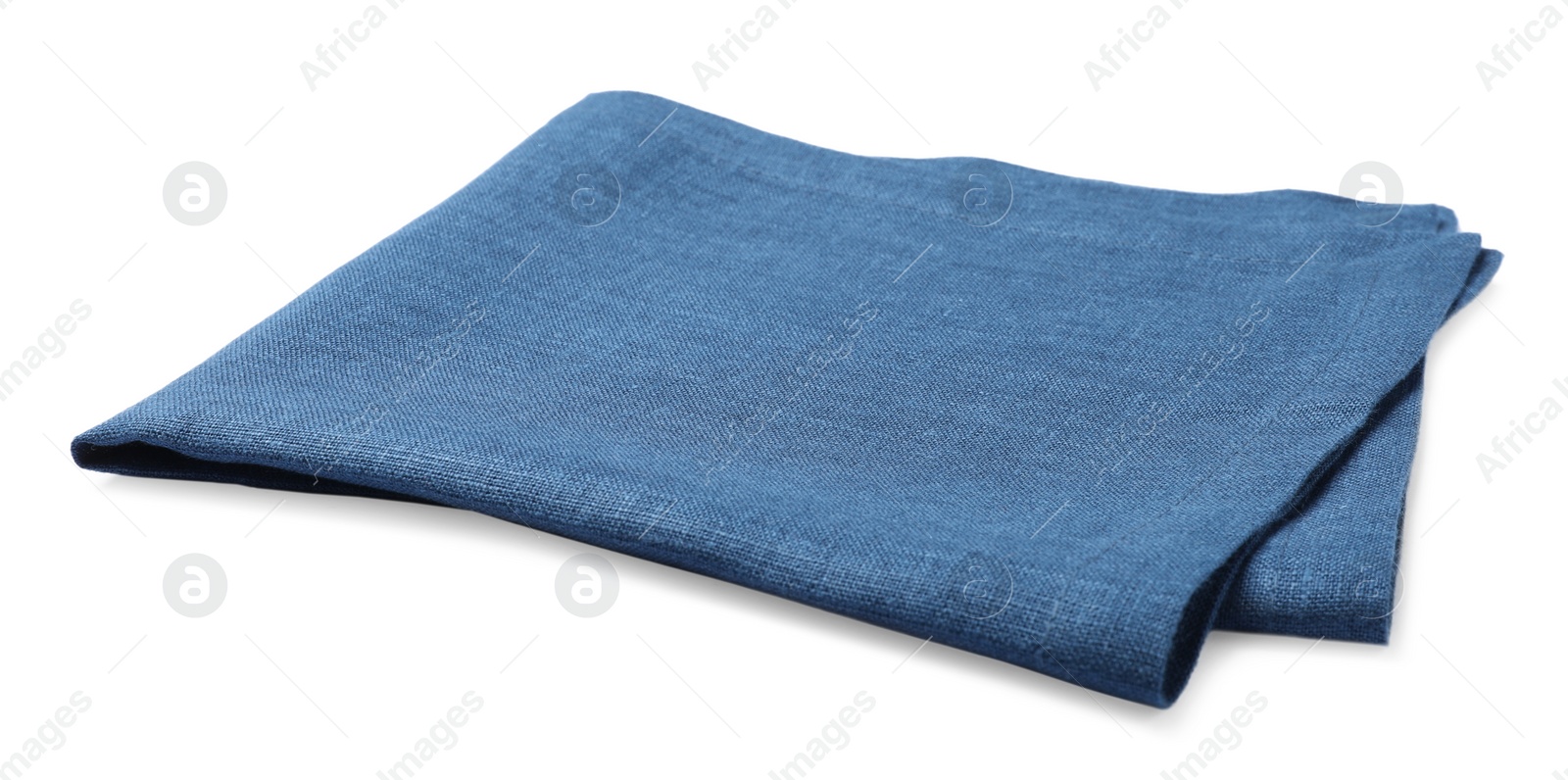 Photo of Blue folded fabric napkin on white background