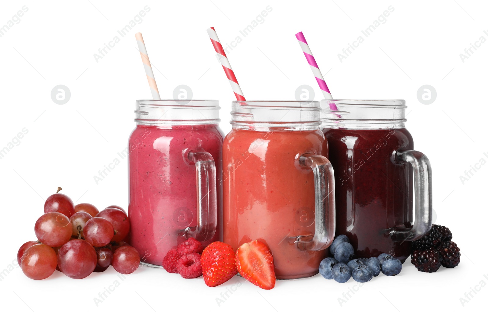 Photo of Different tasty smoothies in mason jars isolated on white