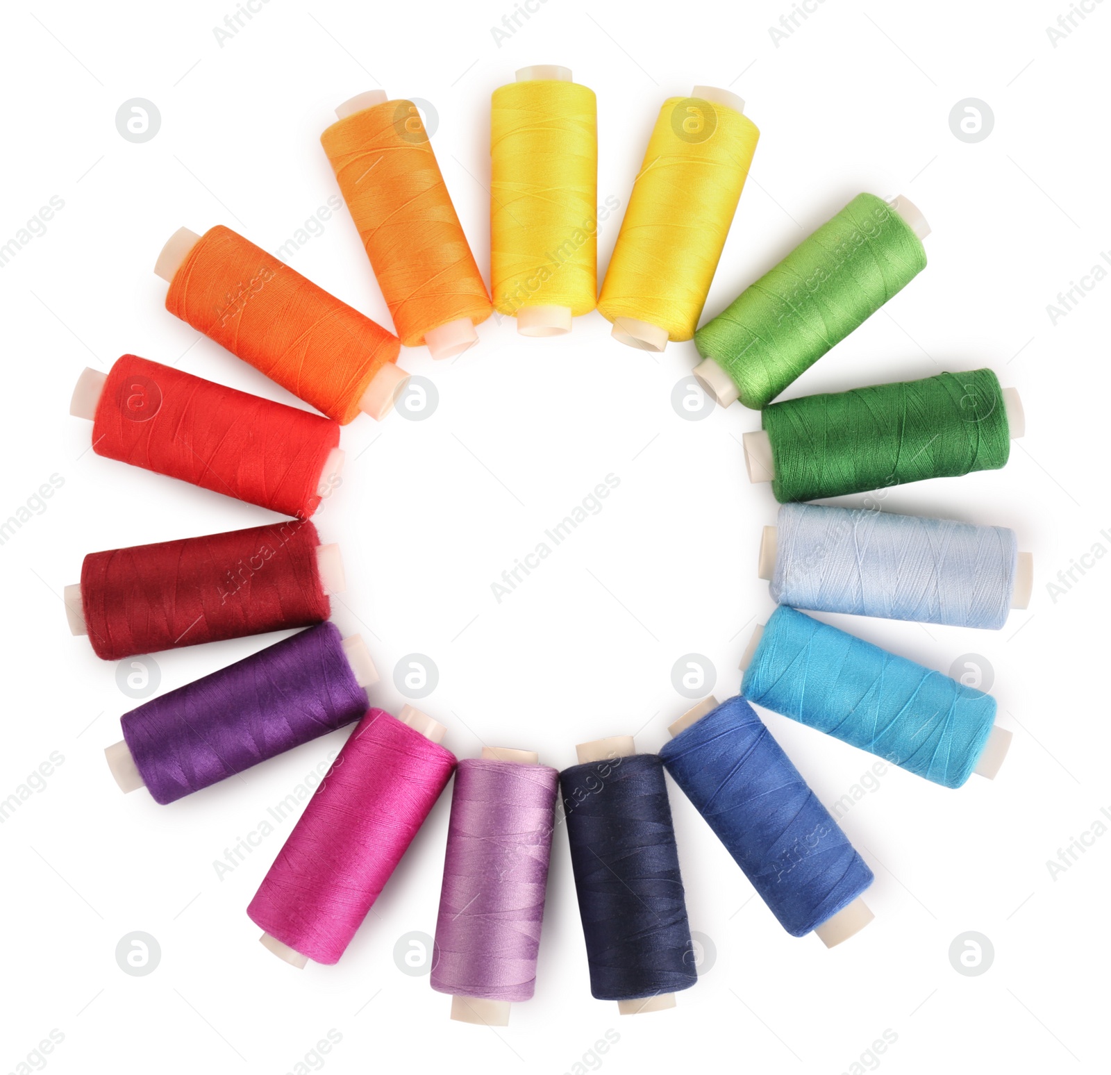 Photo of Frame of colorful sewing threads on white background, top view. Space for text