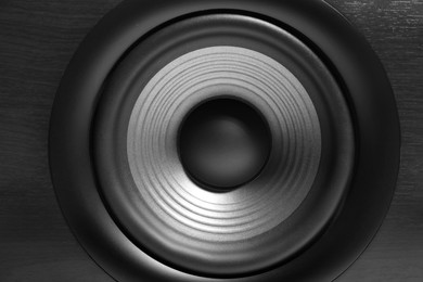 Photo of One wooden sound speaker as background, closeup